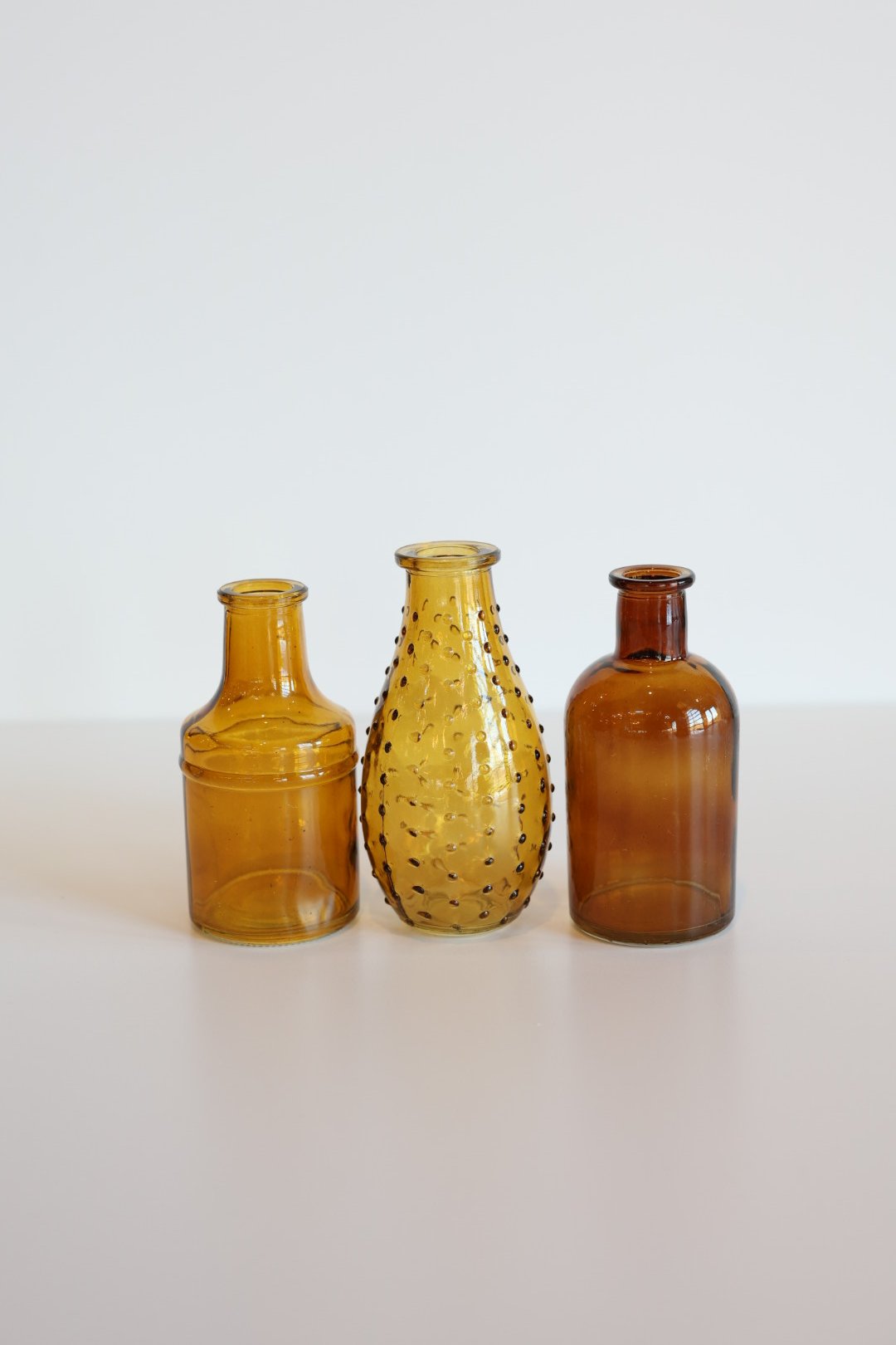 Amber colored small glass vases