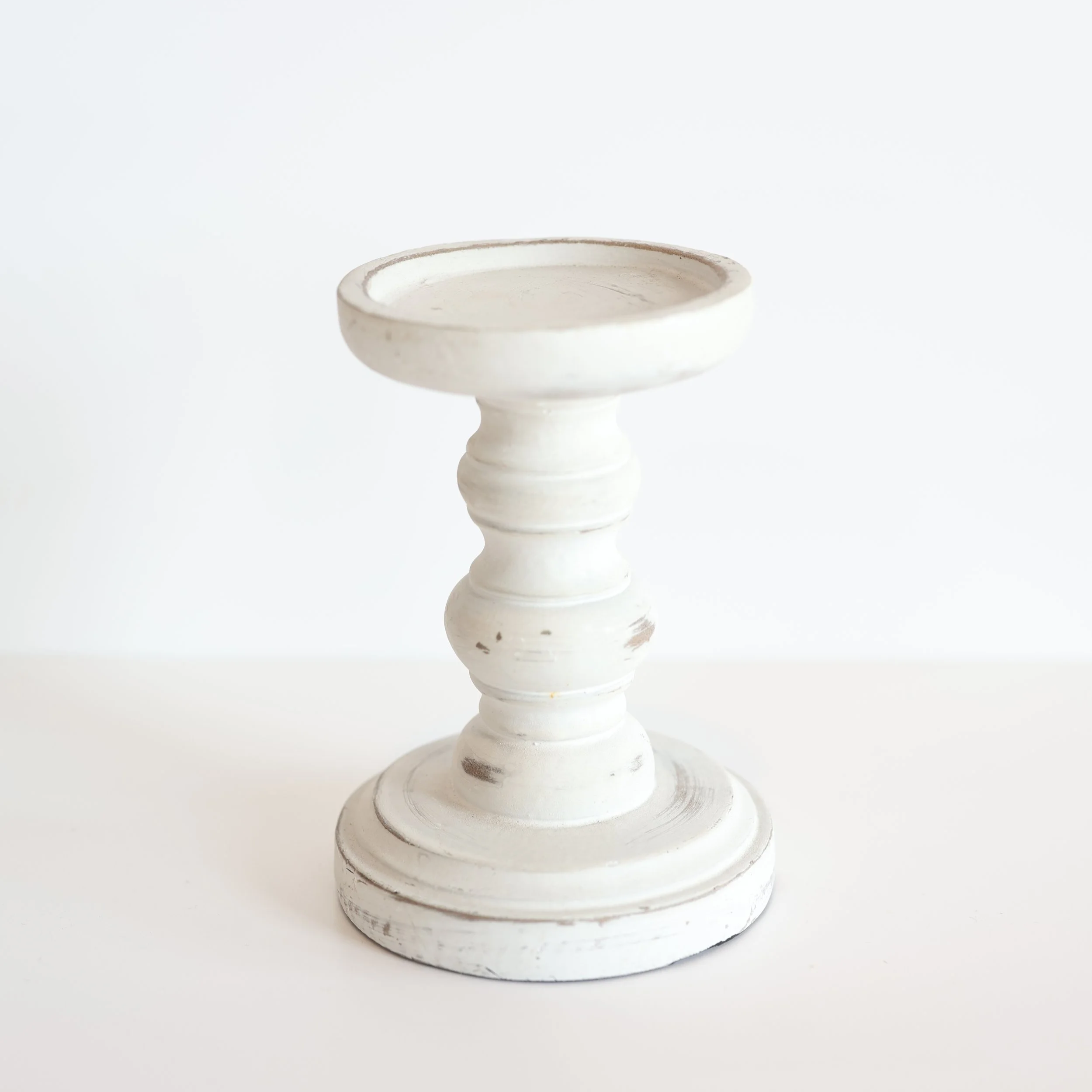 Short white wood pillar candlesticks