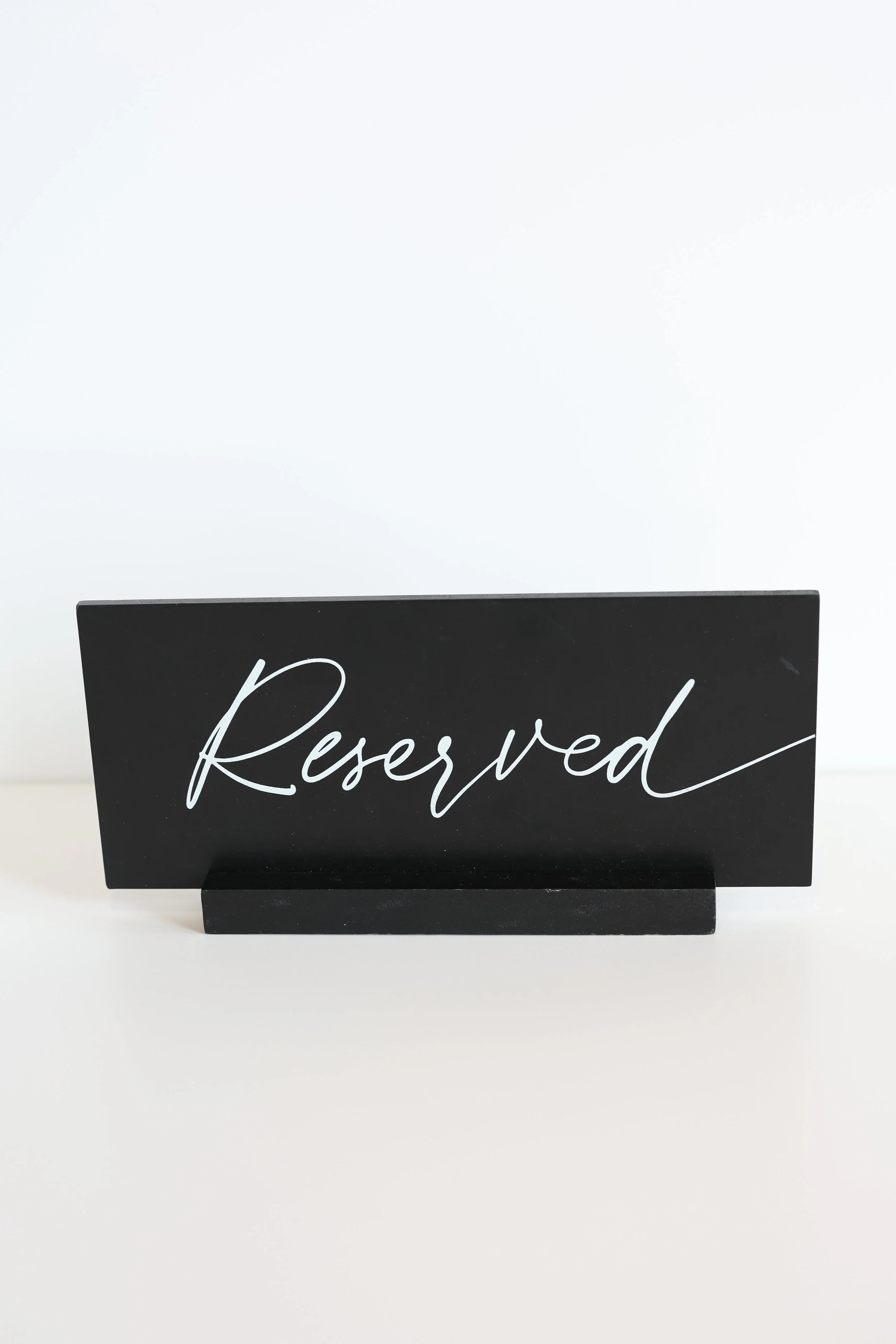 Black "Reserved" Signs