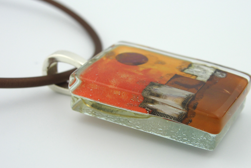 When glass is tack fused, the layers remain distinguishable as separate pieces, even though the glass has fused completely
