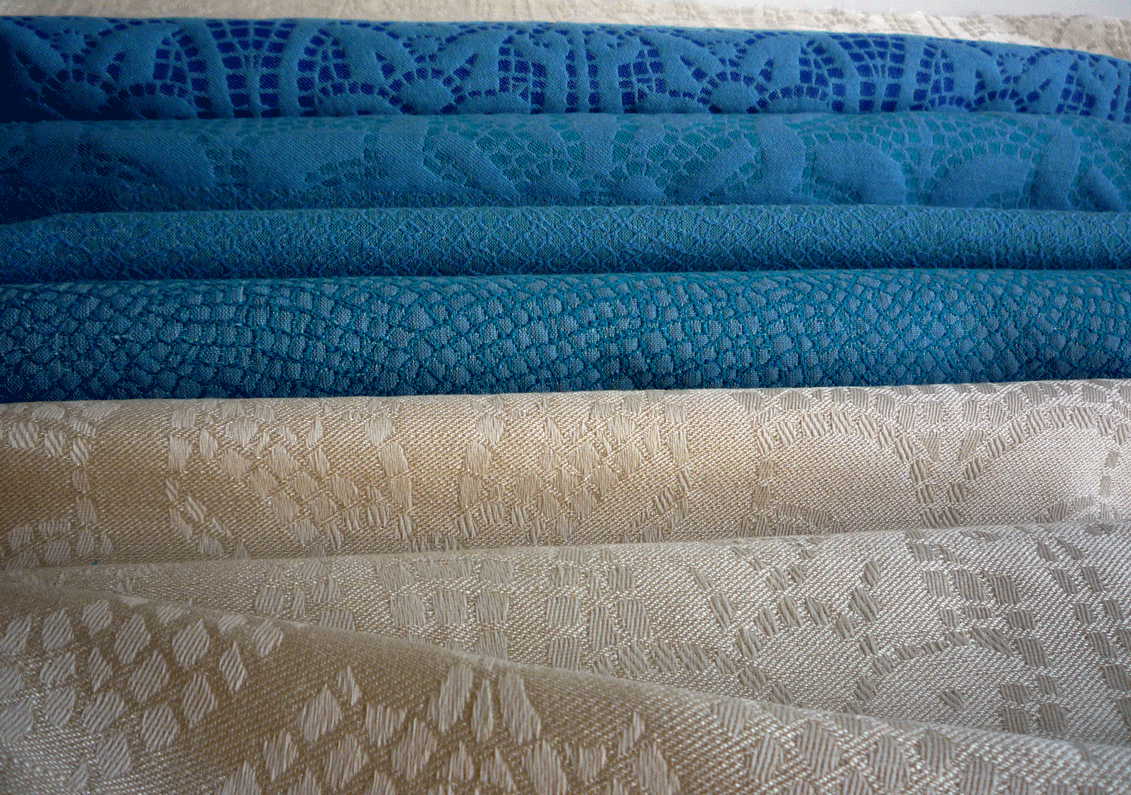 Selection of fabrics woven on the jacquard loom - Cotton warp with wool or silk weft.