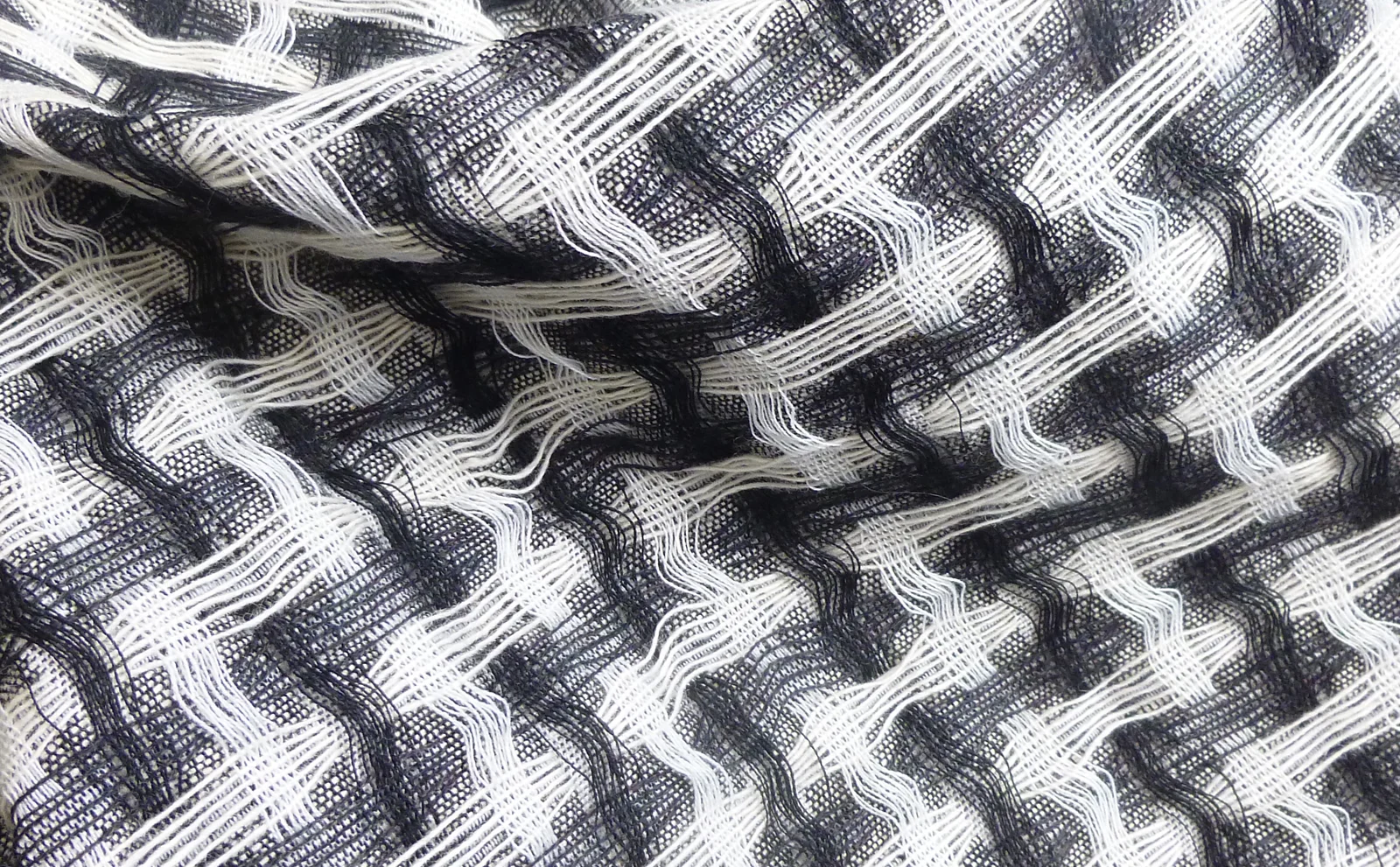 Jacquard woven interlaced fabric. Cashmere and wool 