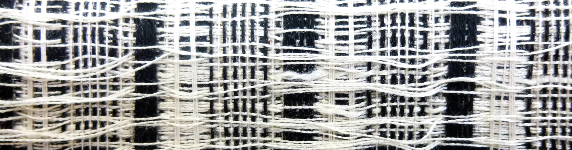 Dobby woven silk, wool and cashmere exploiting loose weave structures on a sound structural base