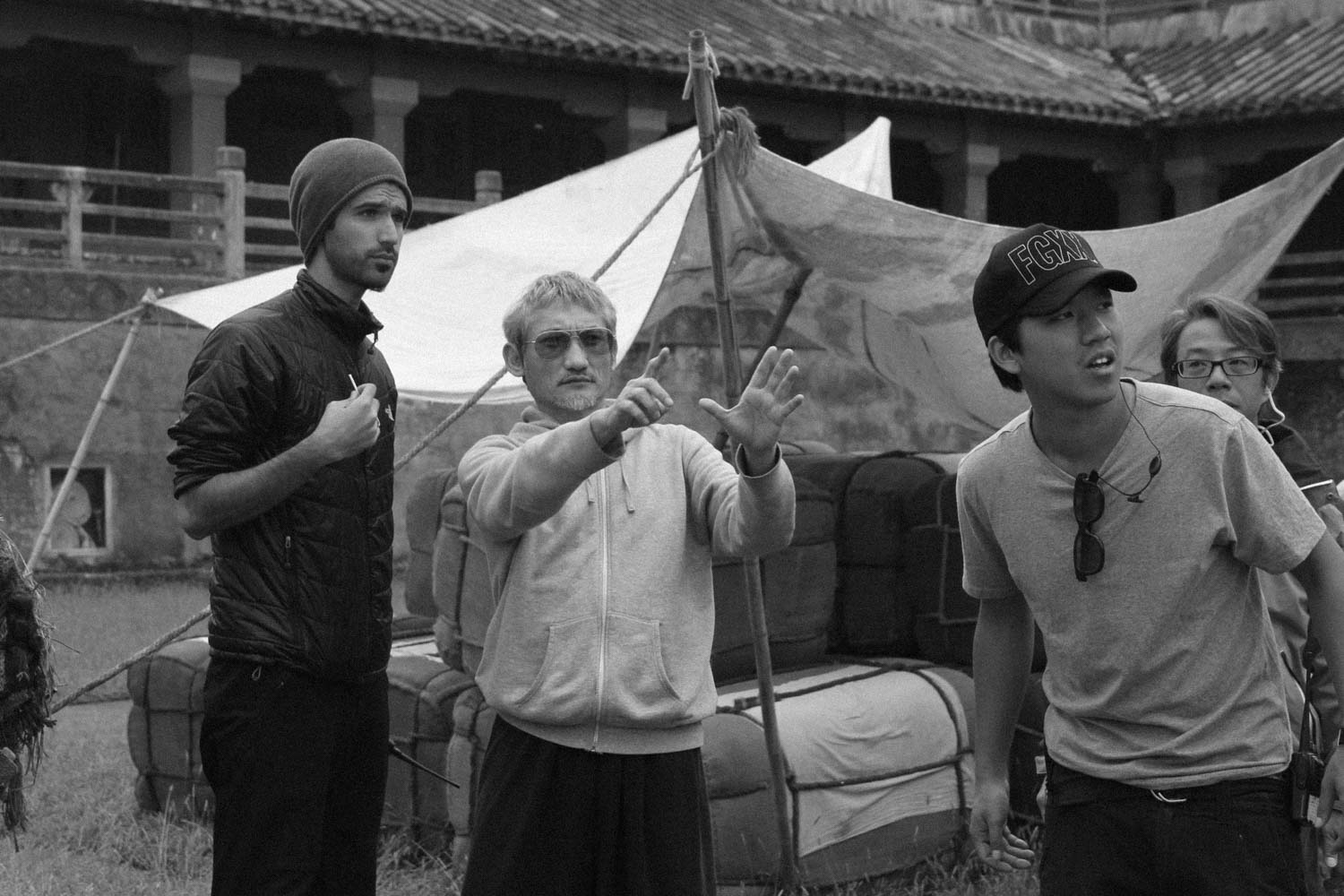 Discussing a shot with director Tsui Hark on the set of Flying Swords of Dragon Gate.