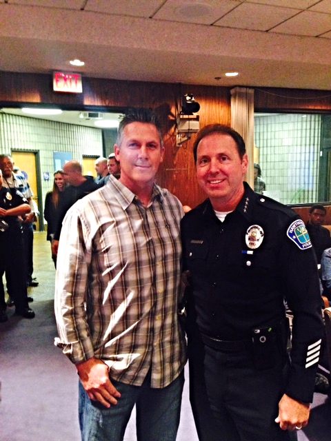 Chief Fager with Detective Johnson at the Council meeting for the proclamation