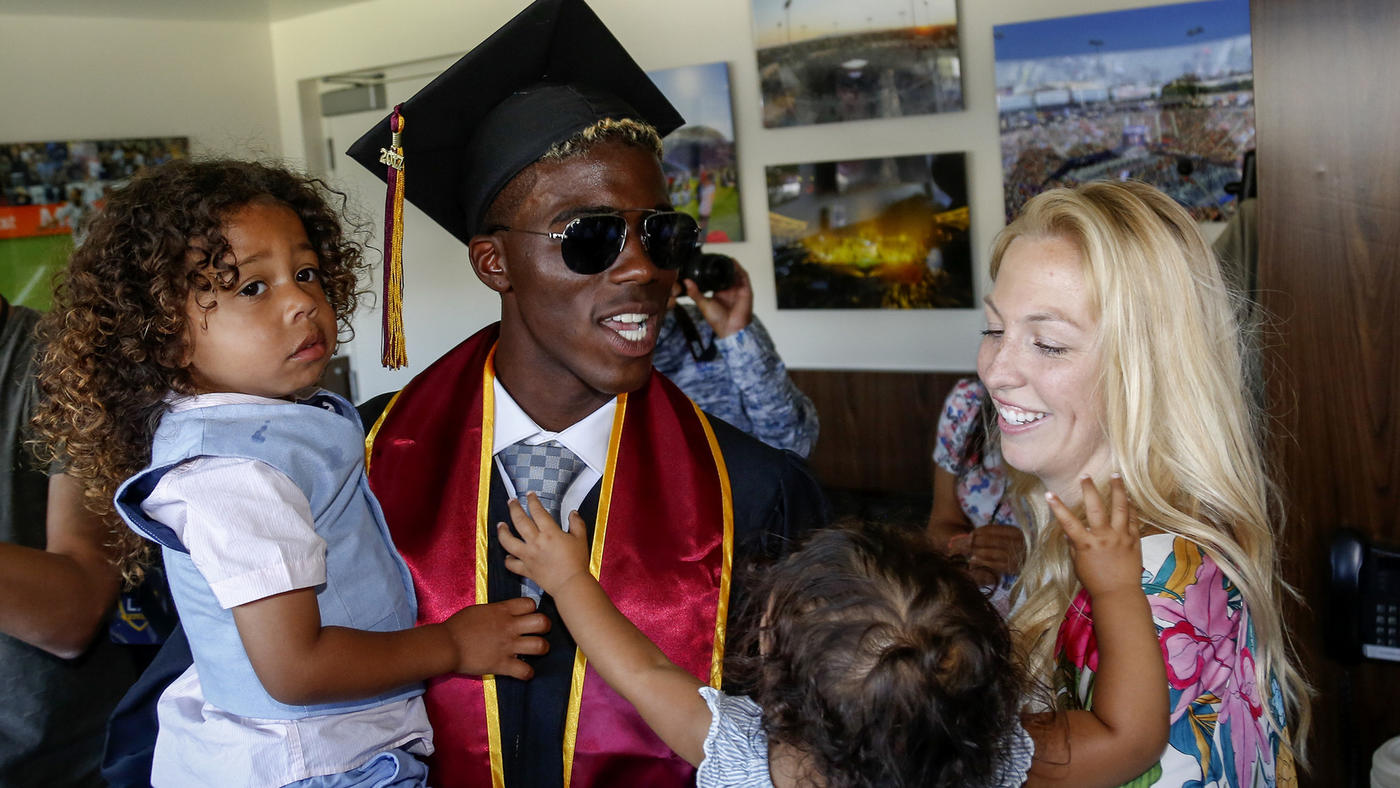  Mark Boster / Los Angeles Times  Galaxy soccer star Gyasi Zardes celebrates with his wife, Madie, and children, Gyan and Maylie, after graduating from Cal State Dominguez Hills. 