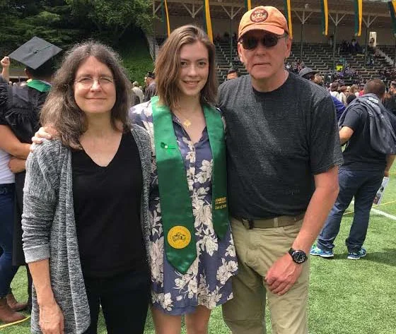 Annie (class of 2008) with her parents at her college commencement ceremony last year. Annie is currently a student at Humboldt State University in Arcata, California