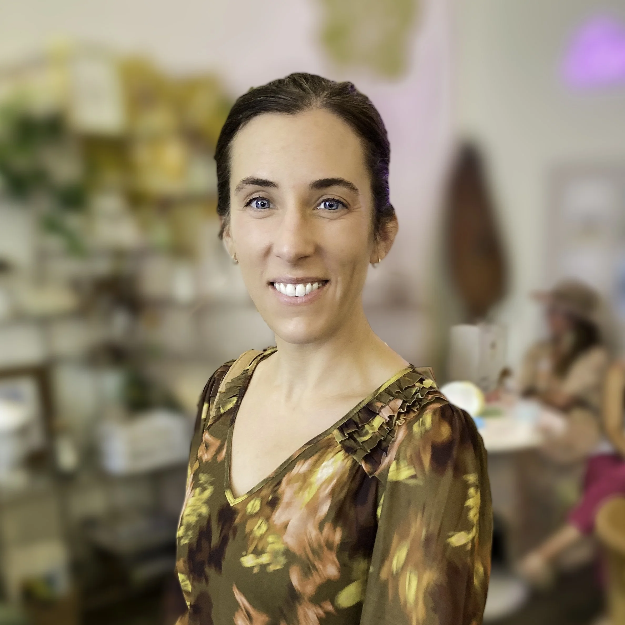 Kristen Walker, professional graphic designer and communications expert, stands for a portrait at a Santa Barbara small business owners event