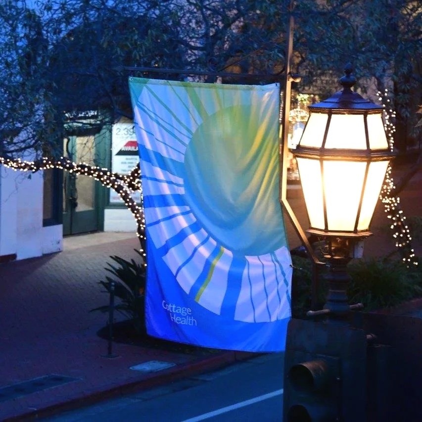 Photo of logo State Street flag in evening light. Photo credit: Glenn Dubock.