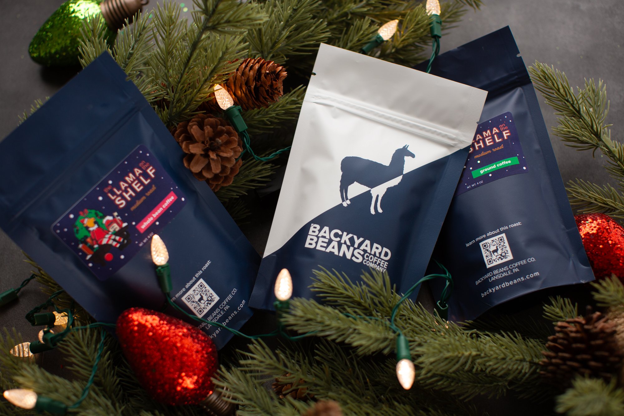 Image of small coffee bags surrounded by holiday elements.