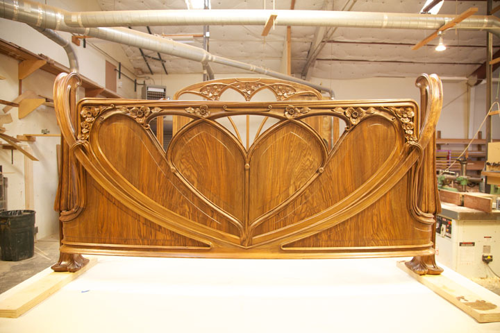 The footboard was redesigned with pierced tracery so the client could view his fireplace.