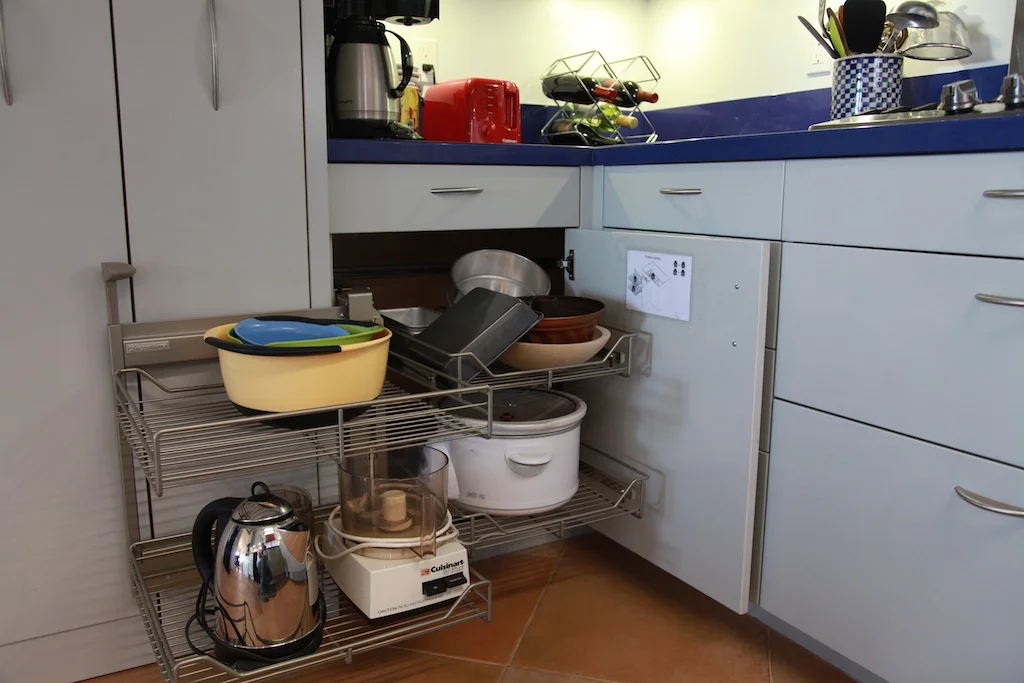 Efficient organization was a focus for this kitchen. These racks pull out to provide storage in a space that would ordinarily be wasted. 