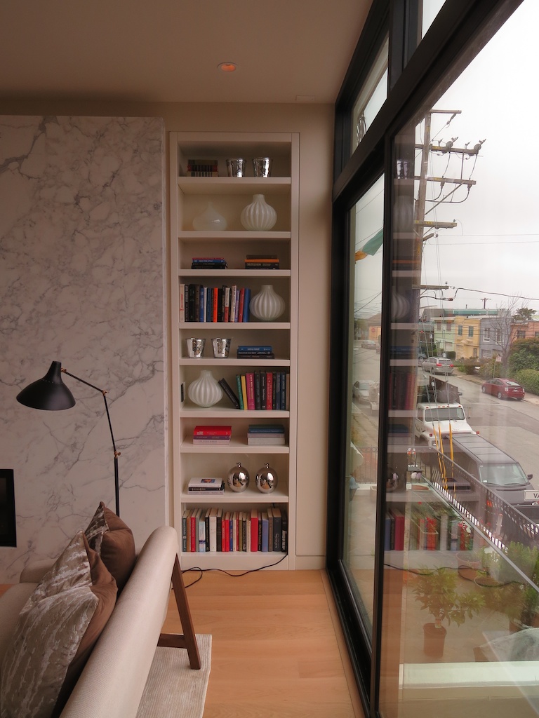 Built-in book case with adjustable shelves. AWL Grip finish.