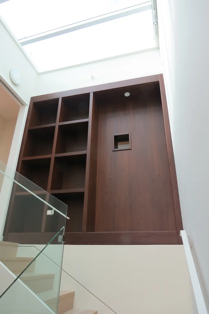 Stairwell cabinet with pressed Walnut veneers.