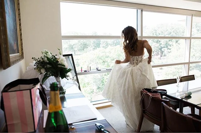 Just a girl, her bouquet, a gorgeous dress, and a bit of champagne. Getting ready for the big moment is the best part!
