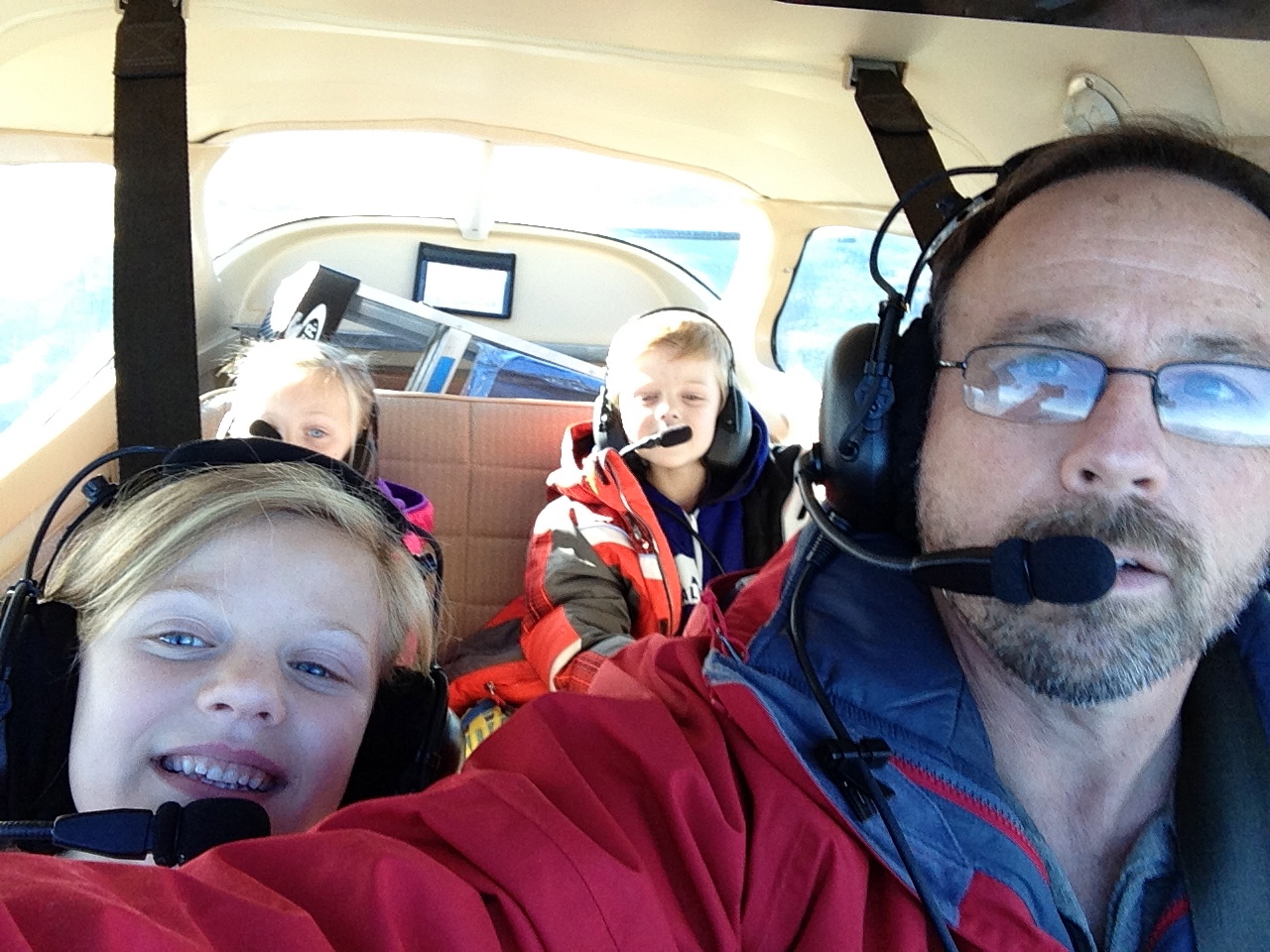 Grandpa taking the kids for a ride in the new plane