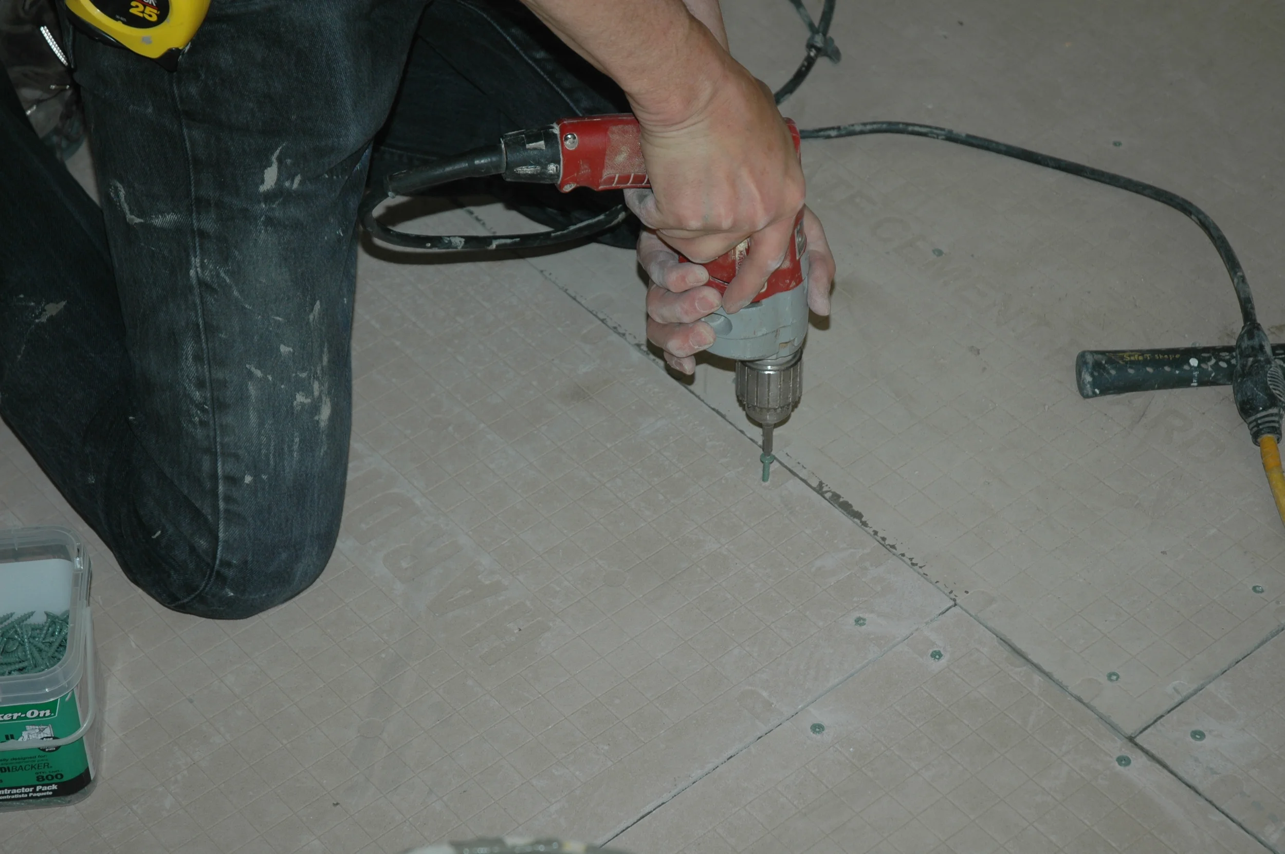 Screwing down backer board after others have gone home & before sound ordinance kicks in