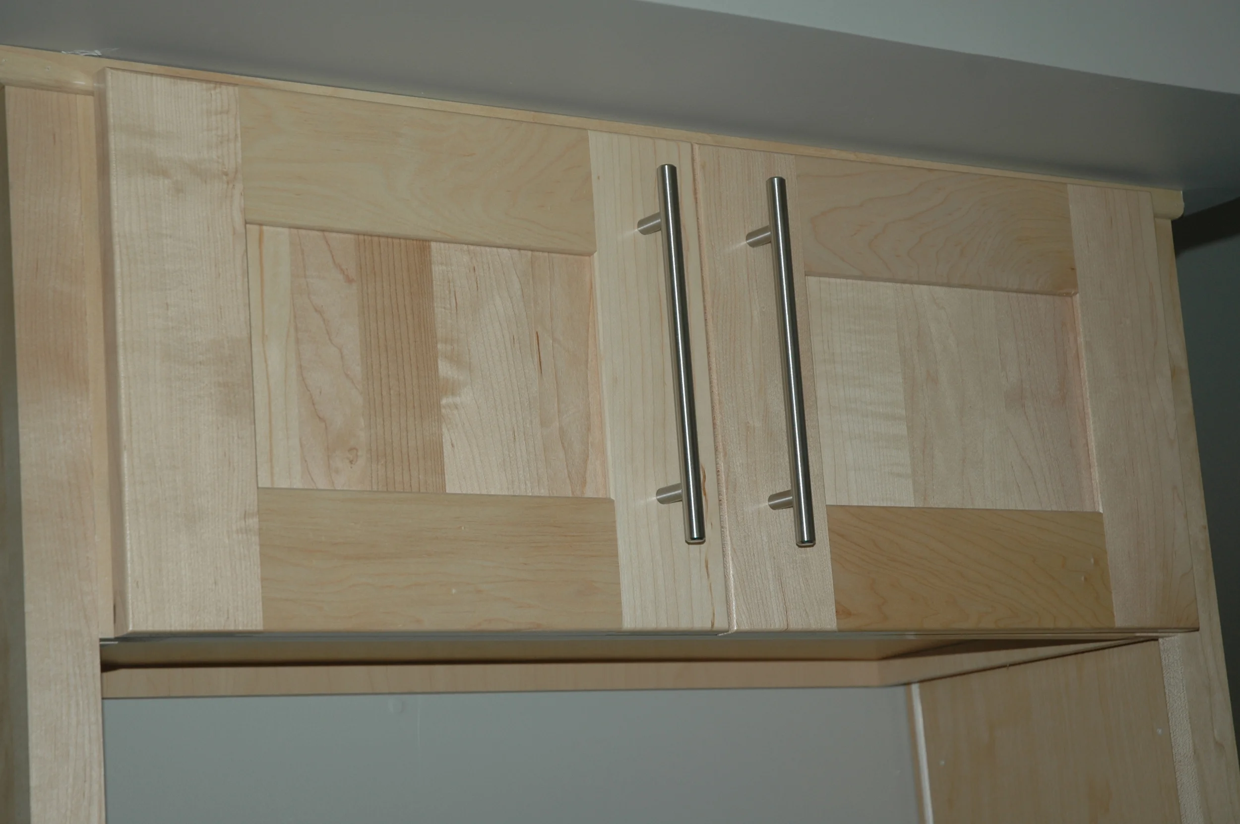 Kitchen cabinet above where the microwave will go