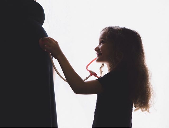 Daughter and soon to be sibling. We turned window light into essentially studio lighting.