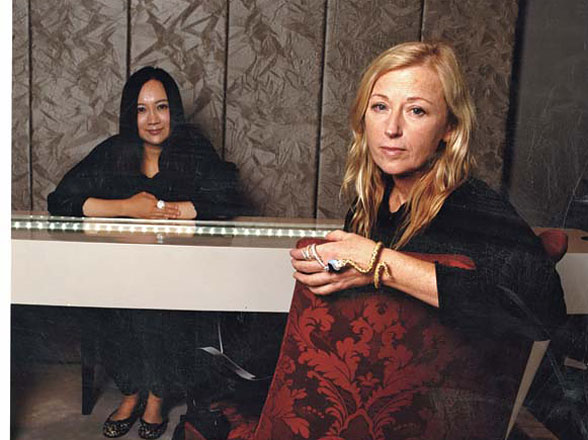 W | Masters' Piece “Wow, wow, wow.” Cindy Sherman, dressed in head-to-toe black, all the way down to her Chanel biker boots, is sitting inside Anna Hu’s glitzy boutique at New York’s Plaza Hotel—far from her usual stomping grounds. She’s so awestruck, she’s on the verge of tears. The story begins this past May at the annual Creative Time art benefit, where Sherman, who would be the first to tell you that she’s hardly a fine jewelry aficionada, was taken with Melva Bucksbaum’s million-dollar necklace—a gigantic lotus-flower stunner, encrusted with pink diamonds, sapphires, and emeralds, designed by Hu. “That’s the first time I heard of Anna,” recalls Sherman. Turns out, one of the evening’s items up for auction was an opportunity to collaborate with Hu on a custom creation. Sherman went for it: “I shot my hand up, taking a chance but assuming that I’d be outbid.” She was, by art connoisseur Amy Phelan, to the tune of $15,000. But when word circulated that Sherman was the underbidder, Hu—who had ardently followed the photographer’s work while studying for master’s degrees at Parsons and Columbia—said she would be honored to make a second piece with Sherman. The next day Sherman matched Phelan’s bid. Two months later, they got started. Hu showed Sherman her collection, which she launched in 2006 and divides into two categories, Western contemporary and Oriental traditionalism. Sherman was drawn to the latter, especially Hu’s fantastical snake, dragon, and frog gems. “I am a fan of insects, reptiles, and mushrooms—things from nature,” says Sherman. As for Hu, snakes are one of her favorite motifs. “In the Egyptian culture, the snake is the goddess of jewelry and the goddess of fortune,” says the jeweler, who was introduced to precious stones as a child in Taiwan by her diamond-dealer father. “It’s almost equivalent to the dragon in Chinese culture.” With that the plan was hatched: a bracelet-ring combo connected by two intertwined serpents, one in 18-karat yellow gold and the other in 18-karat white gold, both set in five carats of white, black, and yellow diamonds and garnets and dotted with pigeon-blood rubies for the eyes. (It goes without saying that the initial $15,000 grew into a much pricier commission.) The bauble is held together by an onyx and mother-of-pearl yin-yang symbol, as well as by seven flexible joints that allow the piece to bend with the knuckles. “If this was made in a jewelry house, it would take at least eight months,” explains Hu. “But I had five French artisans working late into the night to finish it.” (And just in the nick of time—it was completed at 5 a.m. the day of this story’s photo shoot.) Back to the “wows” at the Plaza, where Sherman is still gazing at the new bling wrapped around her wrist and index finger. “It’s like having a little gorgeous pet,” she says. “It almost seems alive. I couldn’t be more thrilled.” So thrilled that the downtown minimalist has turned into a bona fide diamond devotee? “I think it’s too precious to wear all the time,” notes Sherman. “My friends will think I’ve gone completely uptown if I start wearing jewels during the day, although I do love the idea—perhaps when I’m in my 70s.” - Talya Cousins & Sarah Taylor