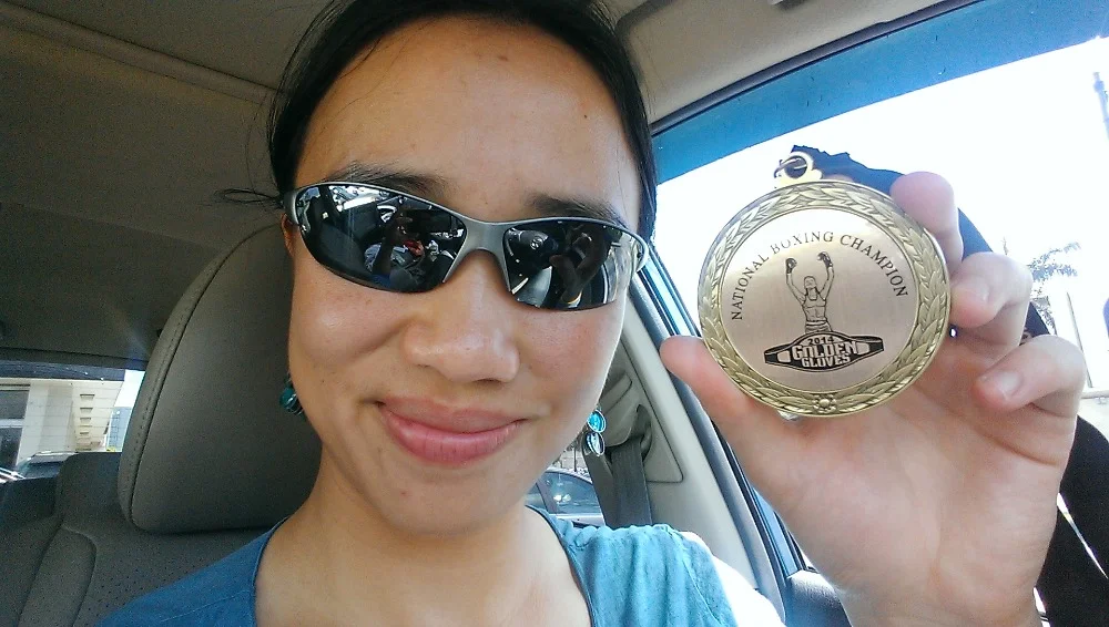 Proudly holding her medal!