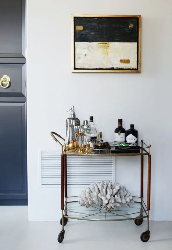 My mama painted the picture above the bar cart. And to her I say: Mad Kudos. The painting was inspired by the doors we saw when her and I traveled throughout Zanzibar.