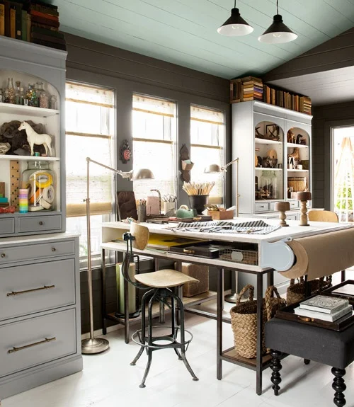 Love the roll of butcher paper at the end of the table. This room actually won the "2012 House of the Year: Home Office" award from Country Living. Not surprising.