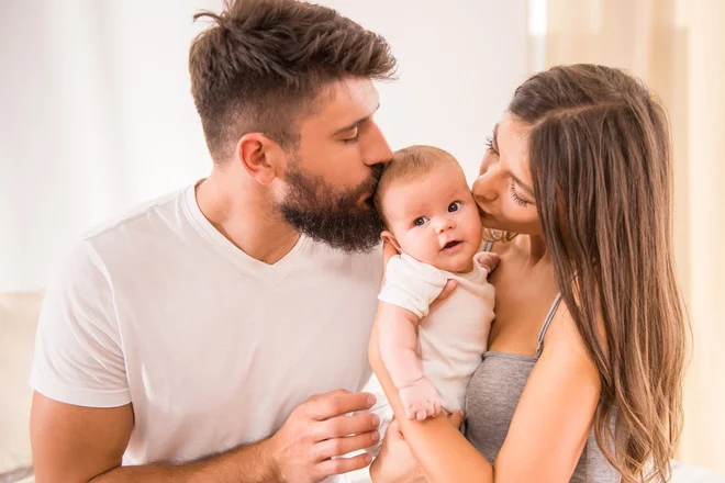 0b64e86b29e6f8d7ec5a32cc53a0c28c52f9addf_young-parents-with-baby (2).jpg