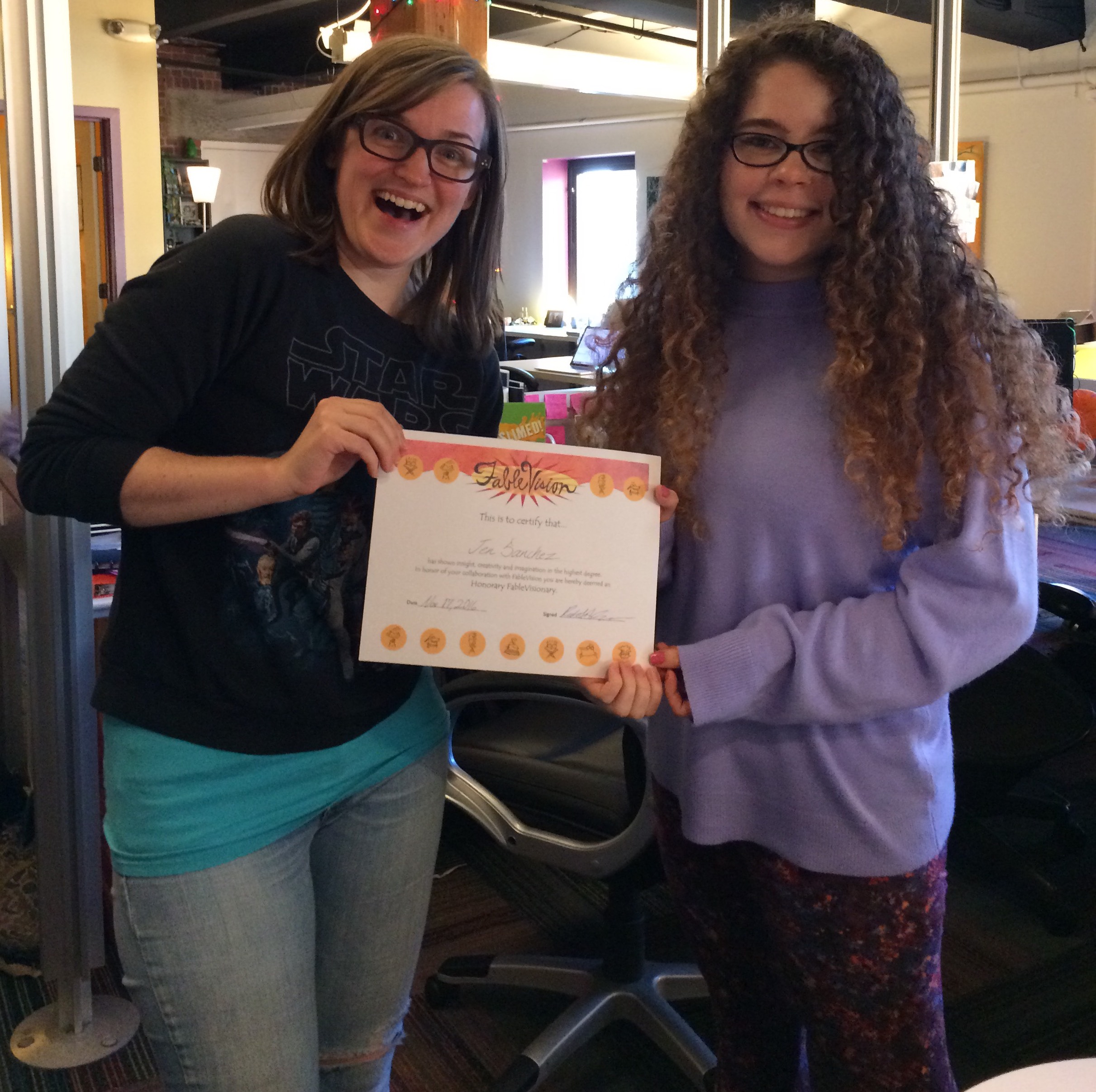FableVision's Hannah O'Neal awarding Jen with an honorary FableVisionary award. 
