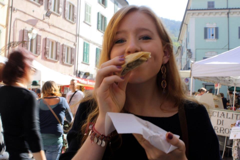  Inhaling a pastry at the  Sagra di Castagne  (chestnut festival) in Marradi, Italy 