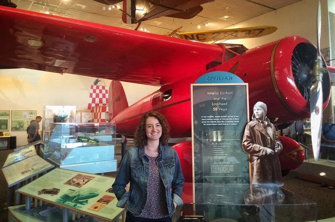 Sarah with Amelia Earhart's Lockheed Vega at the National Air and Space Museum in Washington, DC