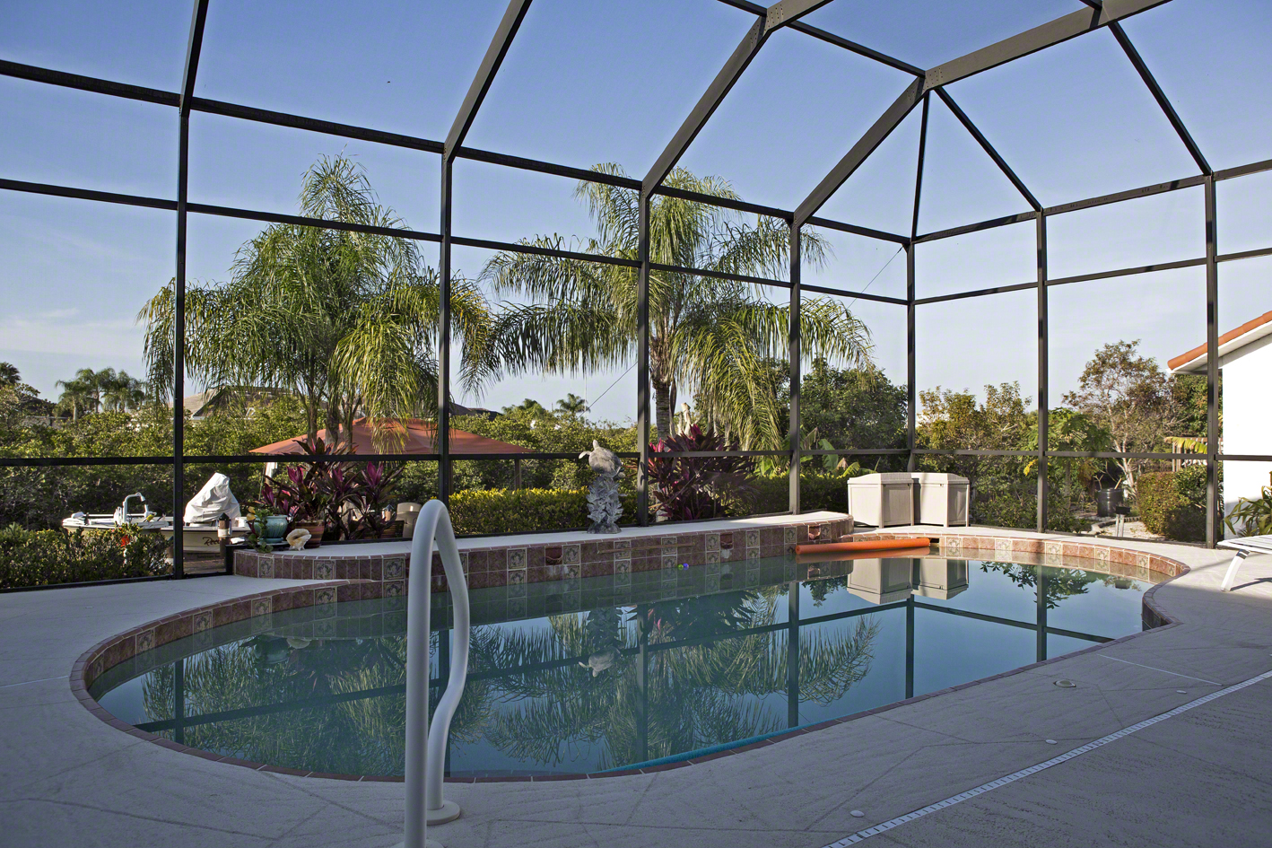 the screened in pool, which overlooks the canal.