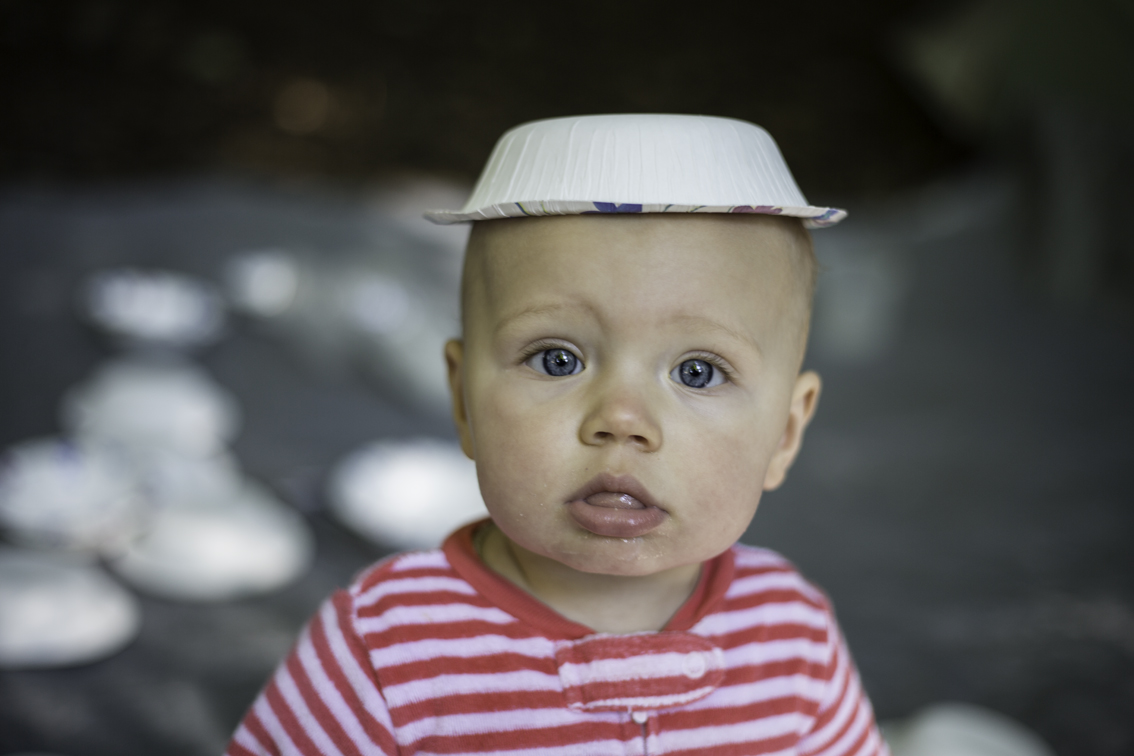 this kid is incredibly fascinated with paper bowls