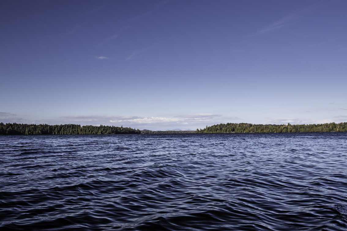the sun came out, and brought back our southerly wind that impeded our process here on little square pond - floodwood mountain rises in the background.