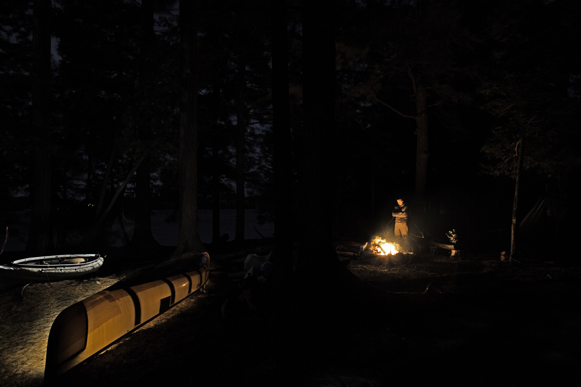 light painting fun - frank keeping warm by the fire at camp the first night of paddling. buck island on upper saranac lake