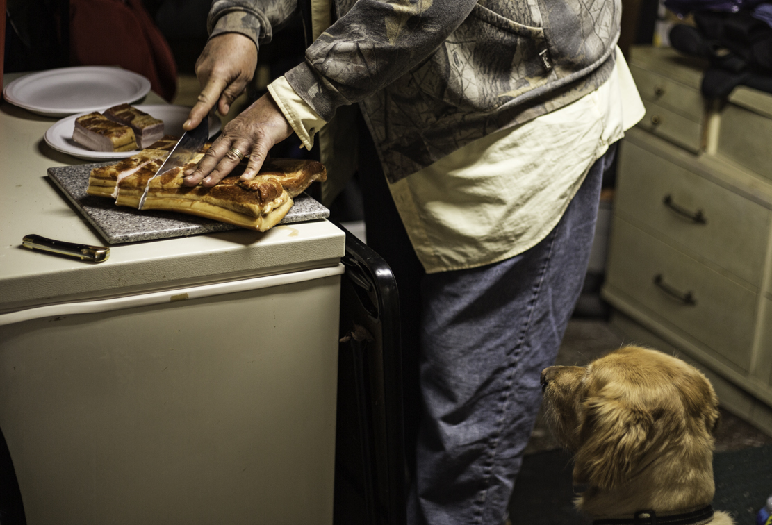 prepping the bacon while max keeps an eye out