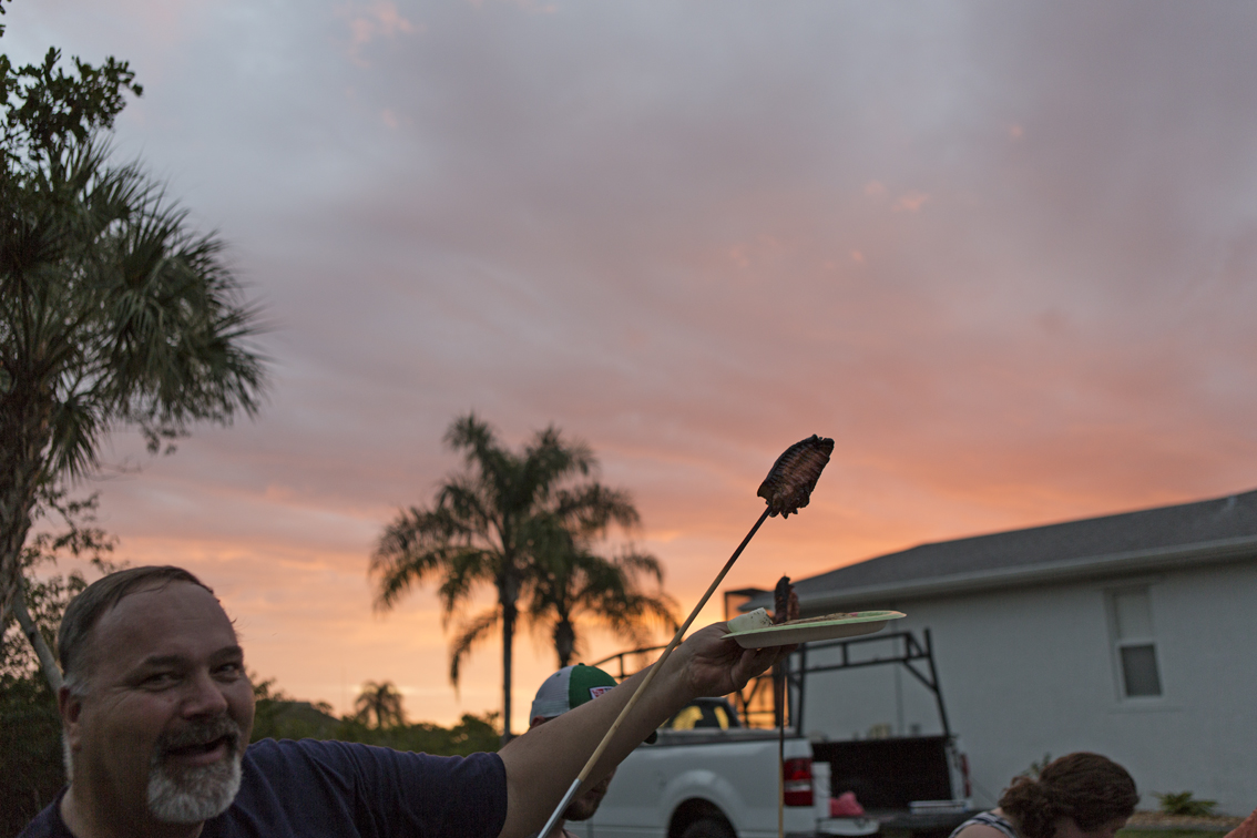 Uncle David proudly displaying his masterpiece with the sunset.