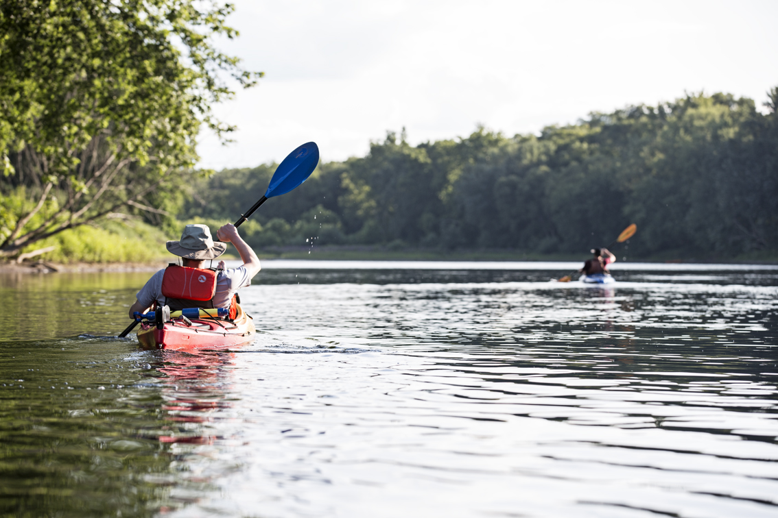 The brothers paddling in unison.
