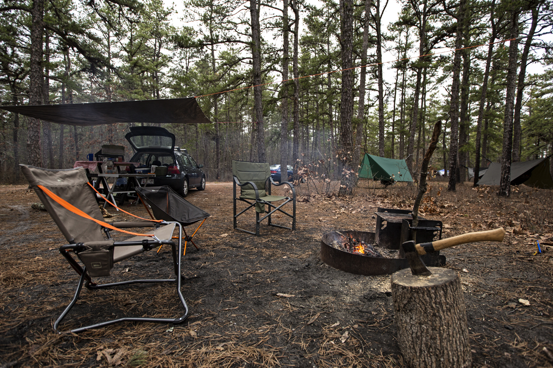 Car camping at its finest. Tables, hatchets, comfy chairs, tarps to make garages with and gourmet food.