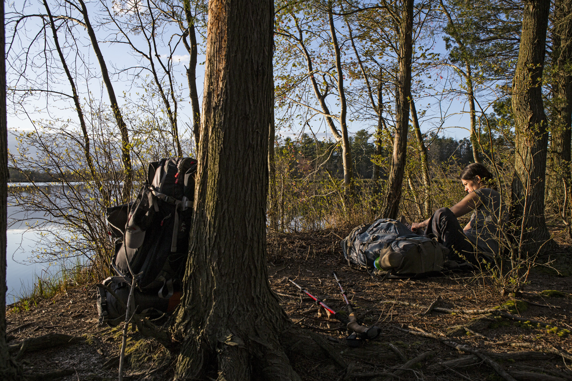 Taking a break and changing footwear along the trail.