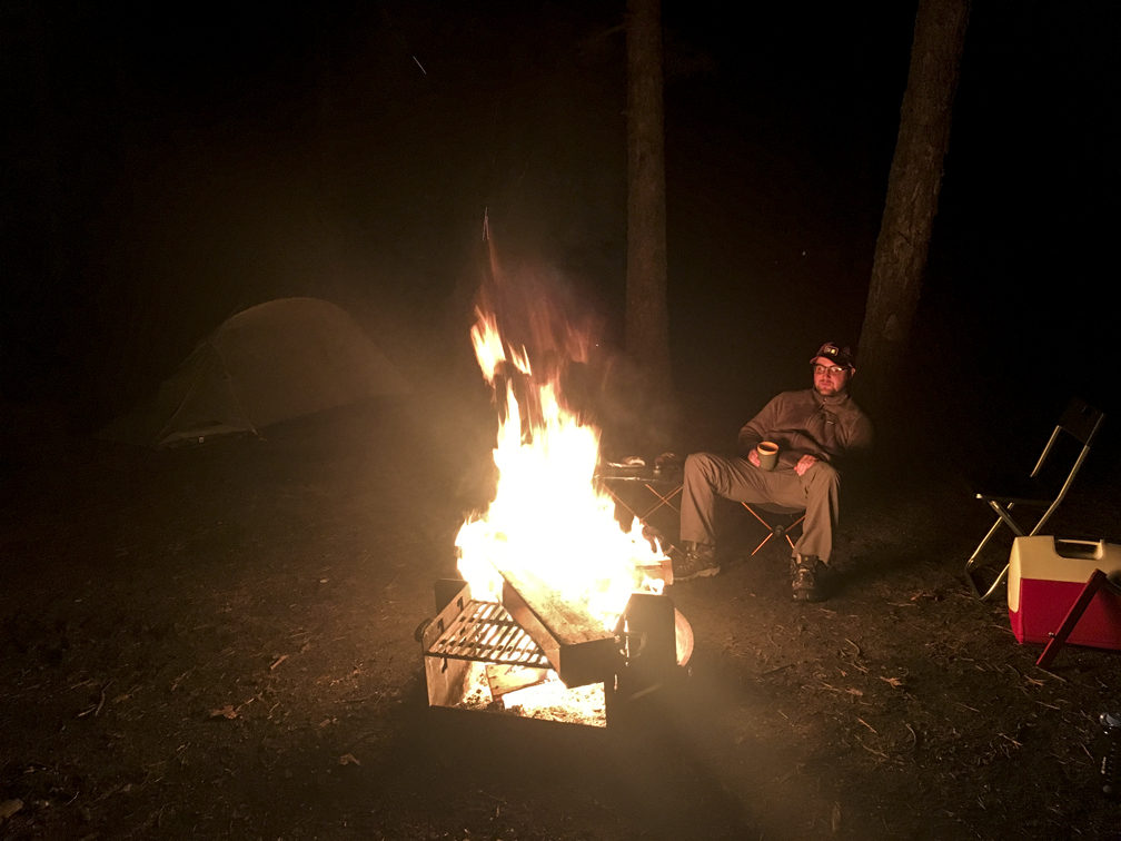 Loren enjoying some booze and a warm fire after getting the car stuck but before the shit really hit the fan. So peaceful.