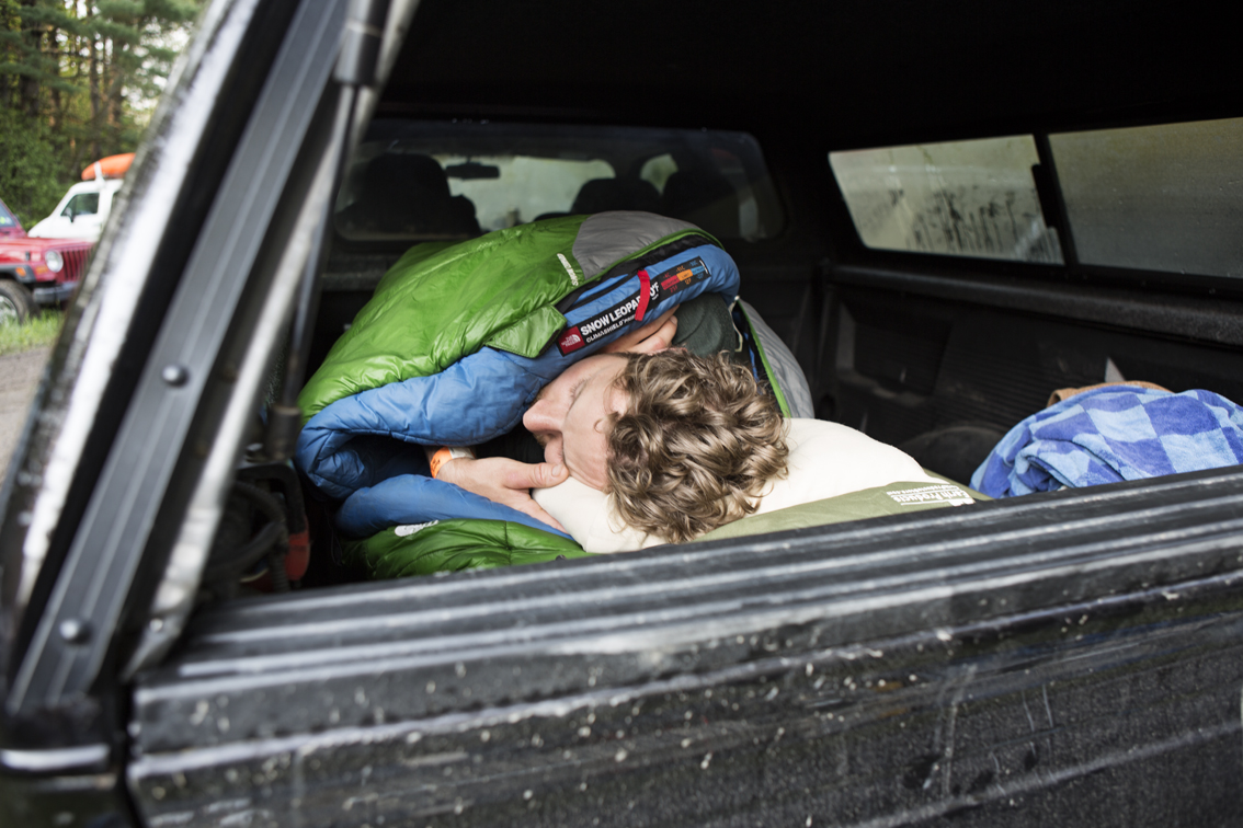 Nate Blick cozied up in the bed of his truck. I rudely woke him up shortly after this.