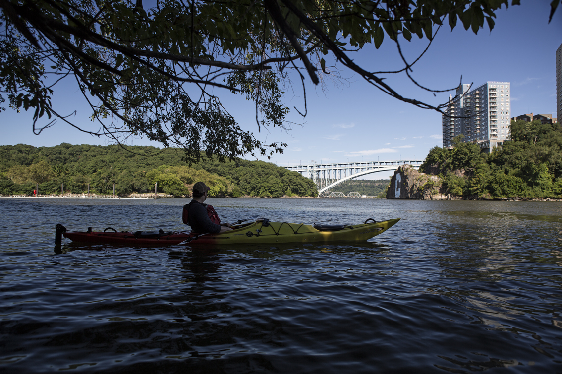 Enjoying some shade near Columbia's boat house, on Spuyten Duyvil creek. The big C is for Columbia University.