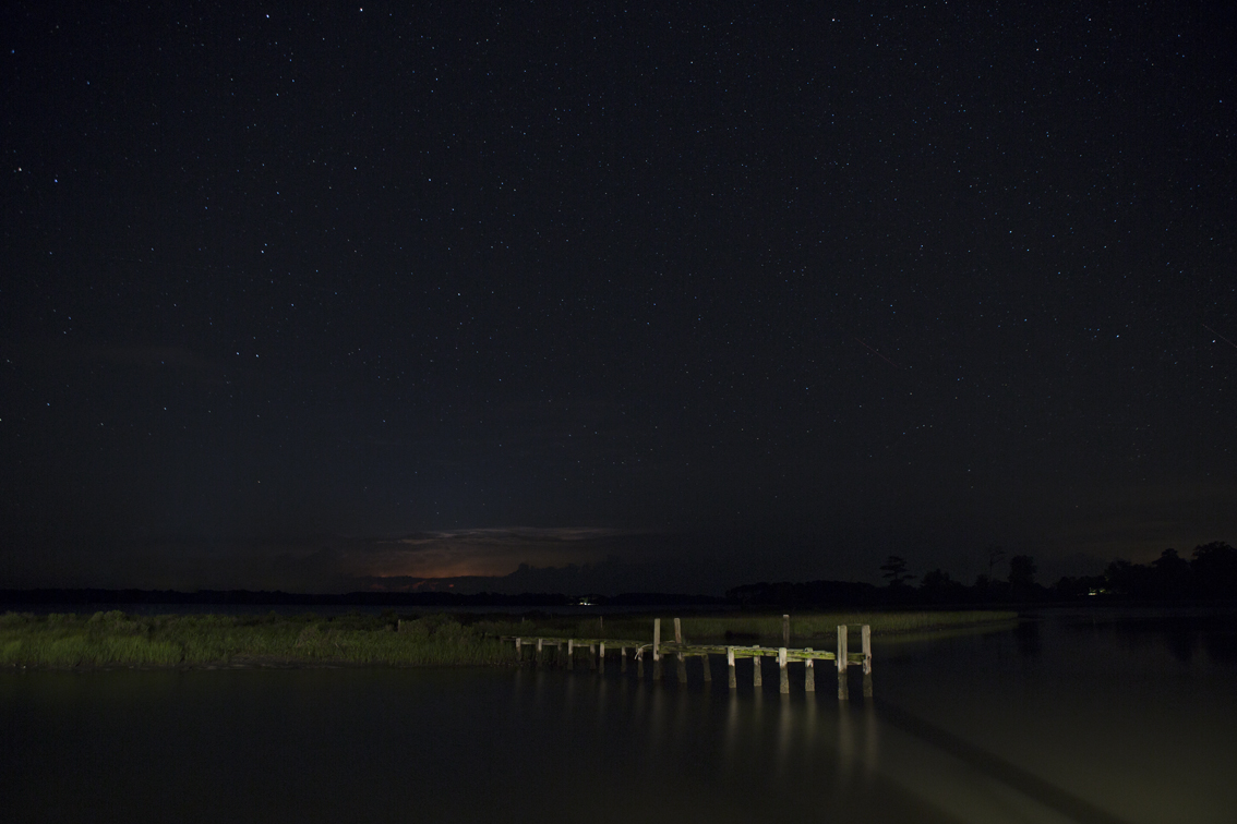 Thunderstorms in the distance, clear skies above.