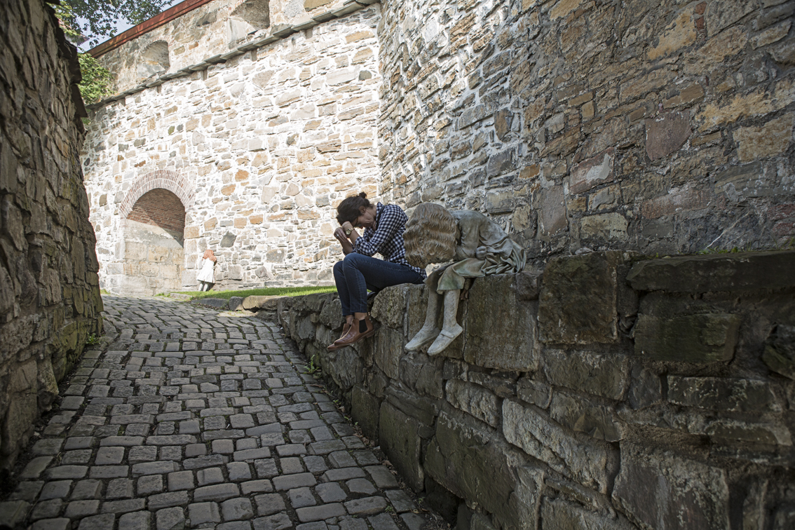 There were these creepy statues of little girls crying and hiding all over the fortress grounds. I talked Sloane into imitating one of them.