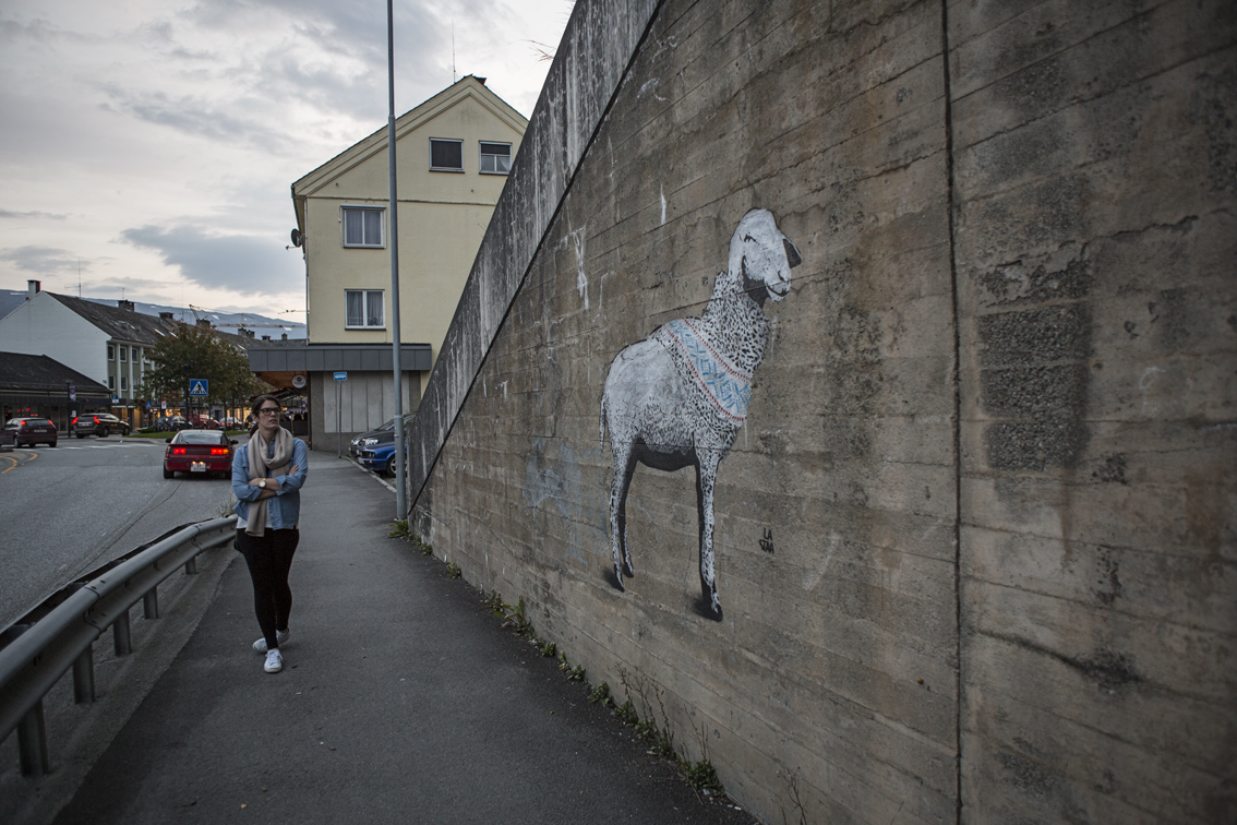 Sloane on the way into town, checking out some Norwegian graffiti. 
