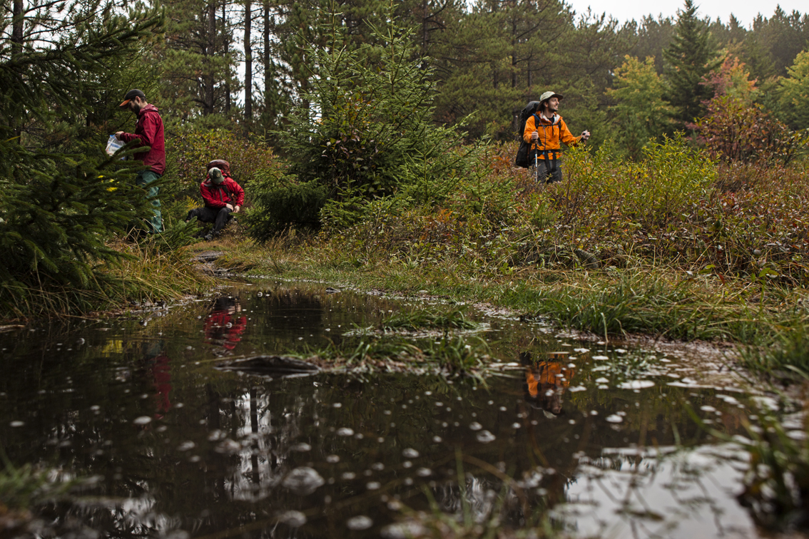 Grabbing a snack and changing socks after a wet creek crossing.