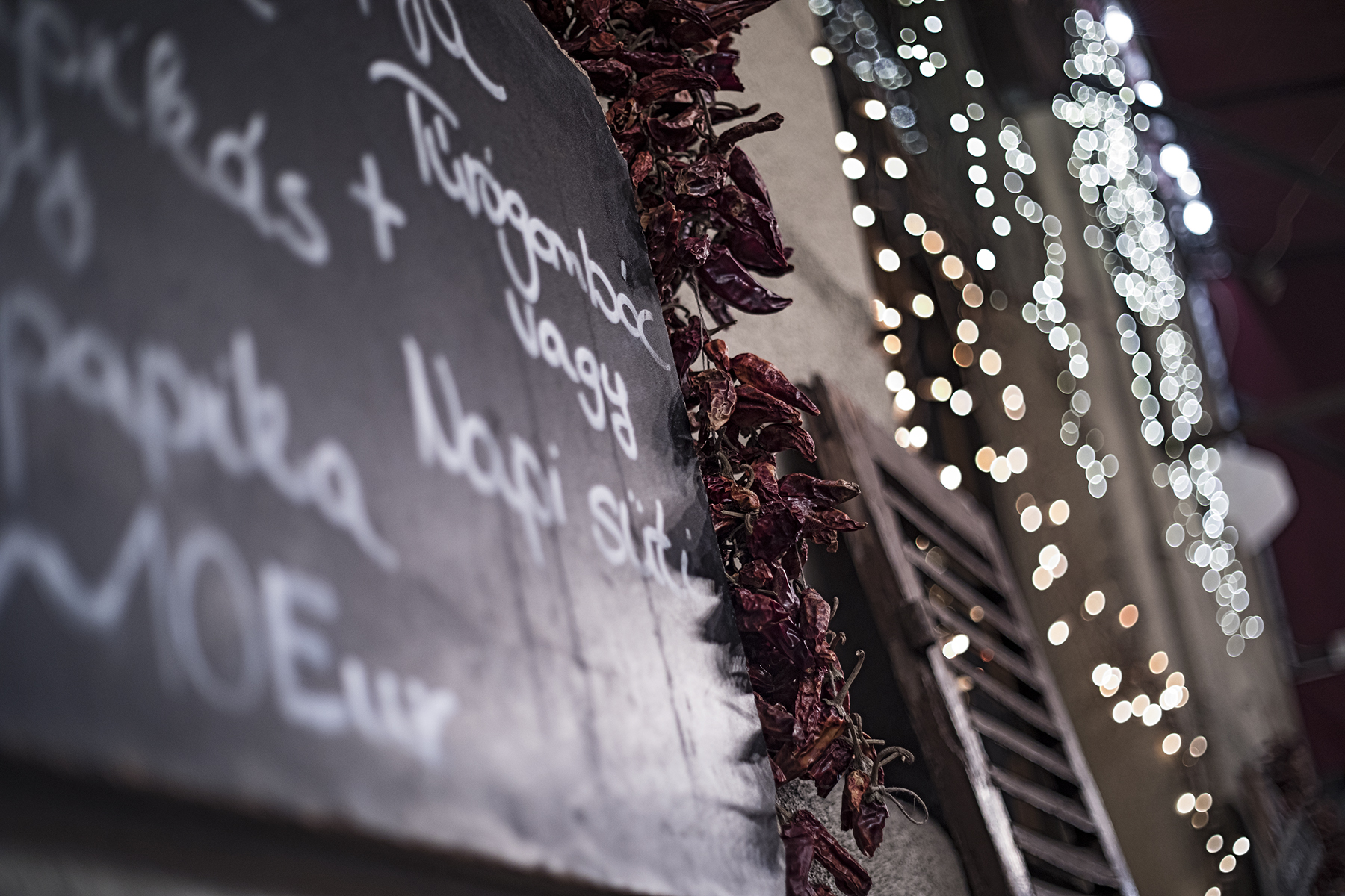 Dried chilis and twinkly lights on the exterior of Kantin - our first Hungarian dining experience.