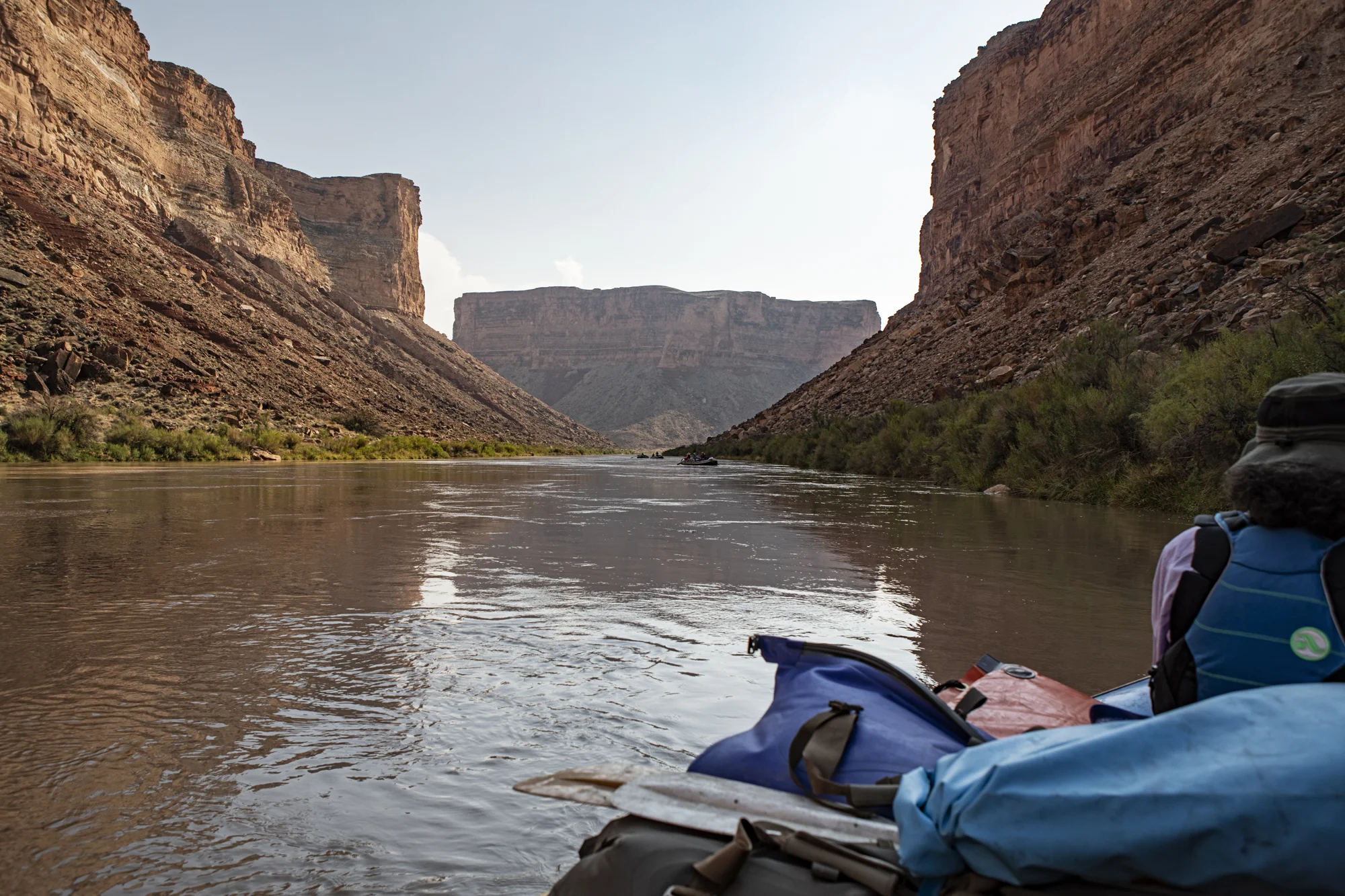 A view downriver, just above our first camp at Soap Creek Rapid. Pat sitting in the bow.