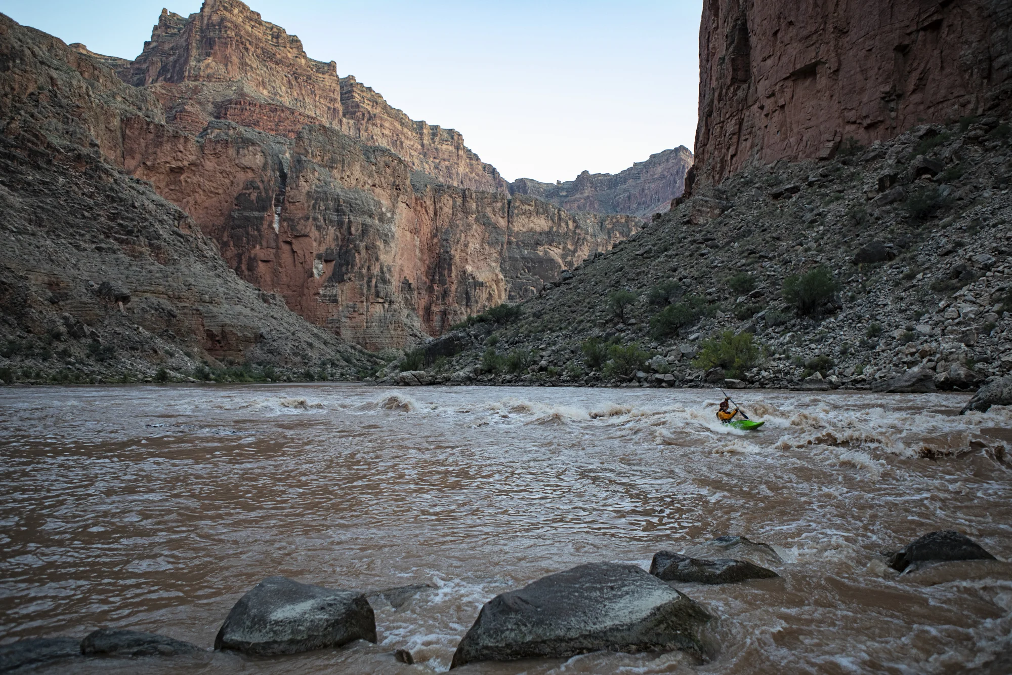Jim surfing on the wave at our campsite at President Harding Rapid.